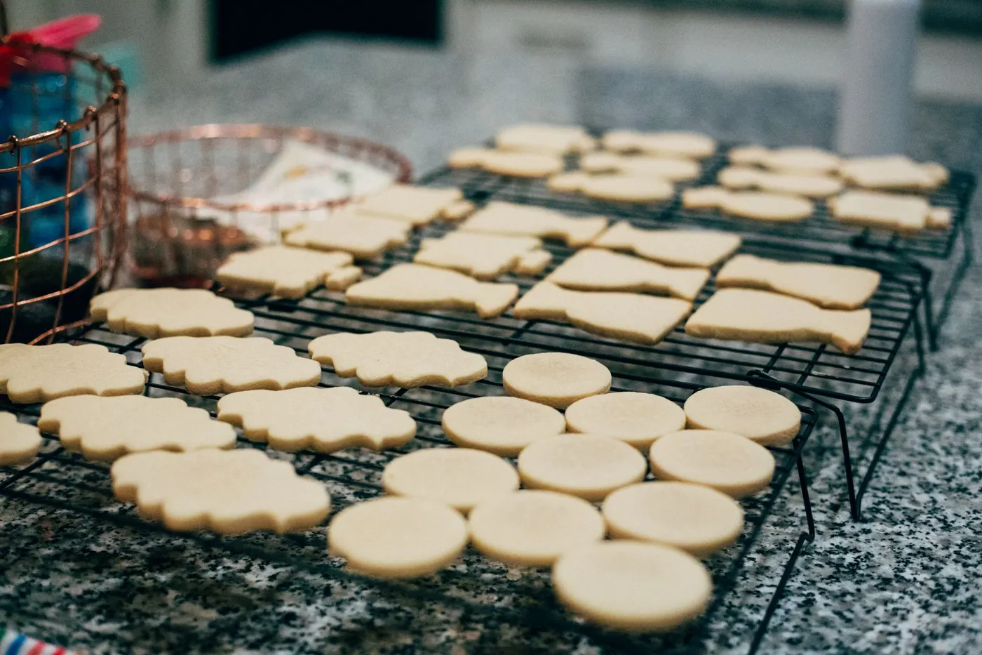 Freshly baked sugar cookies cooling on a wire rack