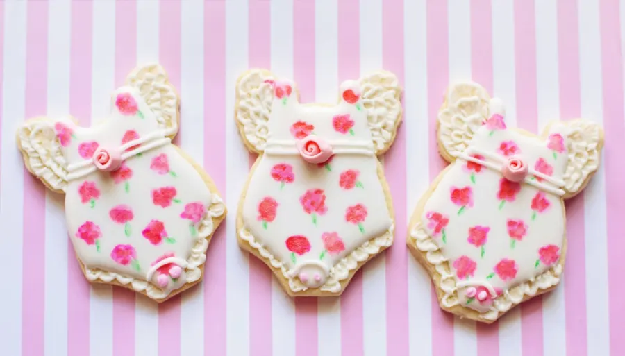 Baby shower onesie cookies with pink roses