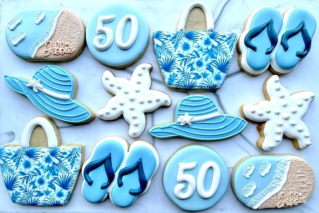 Beach 50th birthday cookies with flip flops and hats