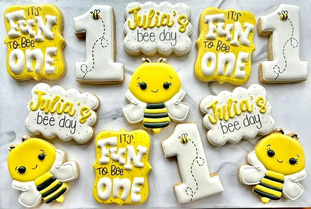 Bee day first birthday cookies in yellow