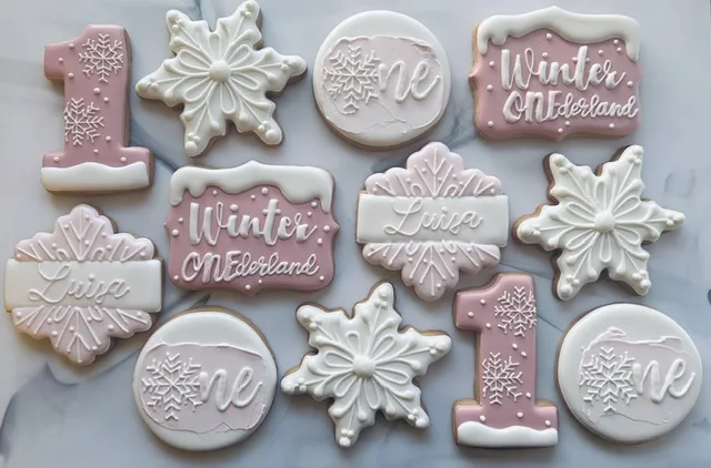 Winter ONEderland first birthday cookies in mauve and white